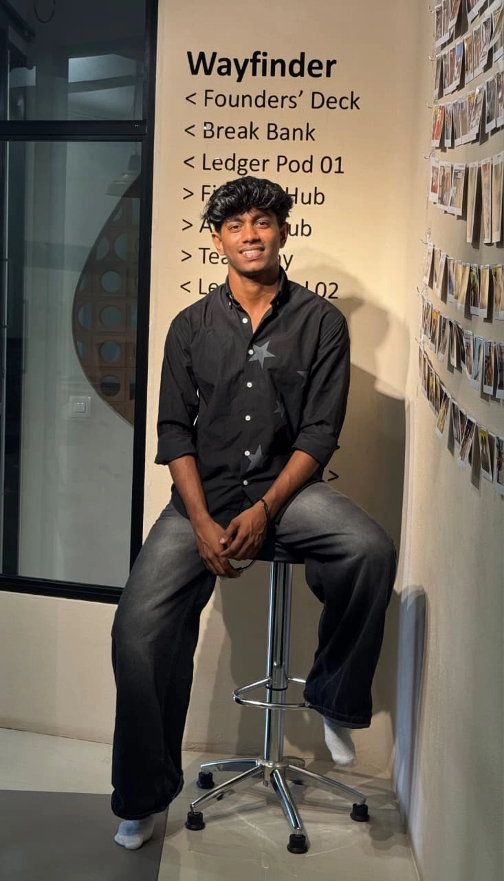 Freelance Digital Marketer in Malappuram posing confidently in a modern coworking space, showcasing a professional personal brand.